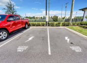 Thumbnail 23 of 32 - a red truck parked in a parking lot