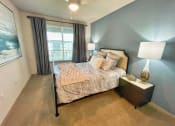Thumbnail 5 of 32 - a bedroom with a bed and a window