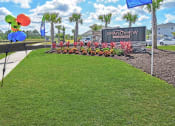 Thumbnail 24 of 37 - our apartments showcase a beautiful lawn
