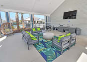 Thumbnail 7 of 37 - gather around the fire pit in the covered patio and watch the game on the flat screen tv