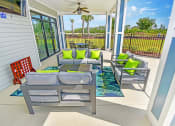 Thumbnail 17 of 37 - take a sip of your favorite drink on the covered patio