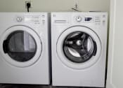 Thumbnail 3 of 10 - a washer and dryer in a laundry room
