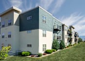 Thumbnail 13 of 20 - a picture of an apartment building with a blue sky in the background
