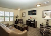 Thumbnail 6 of 20 - a living room with a couch and a coffee table
