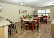 Thumbnail 4 of 20 - a resident clubhouse with a kitchen and dining area