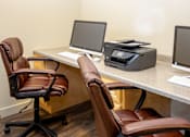 Thumbnail 7 of 20 - a desk with two computers and two chairs