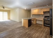 Thumbnail 17 of 20 - an empty living room and kitchen