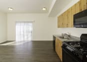 Thumbnail 7 of 10 - a kitchen and living room in an apartment