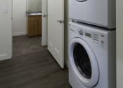 Thumbnail 9 of 10 - a washer and dryer in a laundry room