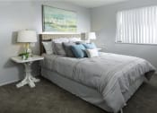 Thumbnail 25 of 32 - a bedroom with a bed and a night stand with two lamps
