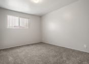 Thumbnail 28 of 32 - an empty room with carpet and a window