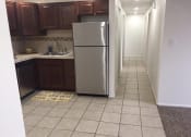 Thumbnail 4 of 4 - a kitchen with a stainless steel refrigerator in it