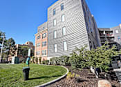 Thumbnail 3 of 31 - an apartment building on the corner of a sidewalk