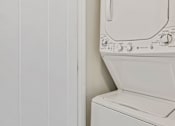 Thumbnail 29 of 31 - a small laundry room with a washer and dryer in it