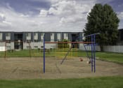 Thumbnail 9 of 32 - a playground in front of an apartment building