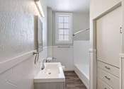 Thumbnail 19 of 19 - an empty bathroom with a sink and a shower