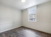Thumbnail 14 of 19 - an empty room with white walls and a window