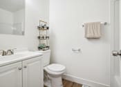 Thumbnail 16 of 17 - a bathroom with a sink toilet and a mirror