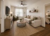 Thumbnail 9 of 24 - Bright living room with comfortable seating, modern décor, and an open layout in a two-bedroom apartment at Auberge of Tyler.