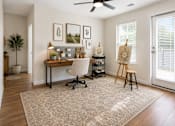 Thumbnail 21 of 24 - Bright flex room staged as a home office and creative workspace at Auberge of Tyler.