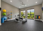 Thumbnail 8 of 24 - Spacious fitness center with cardio and strength-training equipment at Auberge of Tyler.