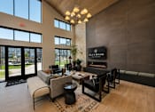 Thumbnail 4 of 47 - Spacious resident clubhouse with gathering spaces, work areas and coffee bar.