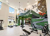 Thumbnail 5 of 47 - Modern fitness center with cardio and strength equipment at The Bluewood