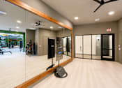 Thumbnail 42 of 47 - Modern fitness center with cardio and strength training equipment.