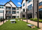 Thumbnail 7 of 47 - Outdoor lawn games and gathering space at The Bluewood