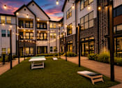 Thumbnail 24 of 47 - Outdoor lawn games and gathering space at The Bluewood