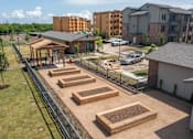 Thumbnail 31 of 32 - Community garden with raised planting beds at One Preston Station Apartments in Celina, Texas.