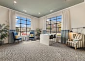 Thumbnail 6 of 19 - Clubhouse lounge and business center with large windows at Auberge of Burleson luxury apartments in Burleson TX.