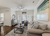 Thumbnail 9 of 19 - Living room interior at Auberge of Burleson apartments in Burleson TX featuring modern décor.