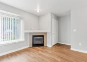 Thumbnail 7 of 38 - A Living Room with a Fireplaceat The Buttes Apartments, Colorado, 80537