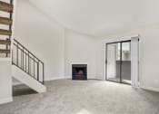 Thumbnail 4 of 29 - A living room with a fireplace and loft at Hilltop View Apartments