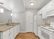 Thumbnail 13 of 38 - A Kitchen at The Buttes Apartments, Loveland, 80537