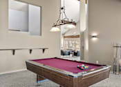 Thumbnail 5 of 27 - Clubhouse with Pool Table at Horizon East Apartments.