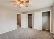 Thumbnail 13 of 17 - A bedroom with a large closet at Alder Square Townhomes Apartments