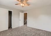 Thumbnail 12 of 17 - A bedroom with a closet at Alder Square Townhomes Apartments