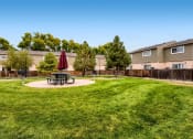 Thumbnail 17 of 17 - The BBQ and Picnic Area at Alder Square Townhomes Apartments