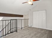 Thumbnail 11 of 29 - An upstairs loft with closet at Hilltop View Apartments