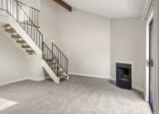 Thumbnail 5 of 29 - A living room with a fireplace and loft at Hilltop View Apartments