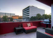 Thumbnail 8 of 21 - Our Apartment Common Area Patio with BBQ Grill at Sleek Lofts Apartments