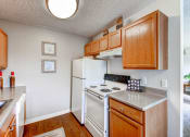 Thumbnail 8 of 21 - A Standard Kitchen at Greentree Village Apartments