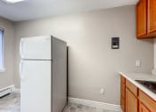 Thumbnail 11 of 15 - Kitchen with white appliances at Fountainhead Apartments, Denver, Colorado