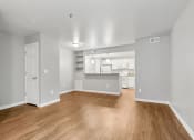 Thumbnail 8 of 38 - A Living Room with a view of the Kitchen at The Buttes Apartments, Loveland, 80537