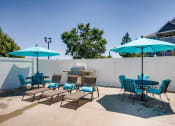 Thumbnail 22 of 29 - The Community Outdoor Pool Lounge Area at Eagles Landing Apartments