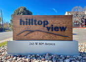 Thumbnail 1 of 29 - A wooden sign with the words "hilltop view" on it.