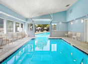 Thumbnail 24 of 27 - The Indoor/Outdoor Pool at Horizon East Apartments.