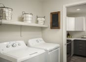 Thumbnail 34 of 42 - Dedicated laundry room off the kitchen at Trevi Apartment Homes, Arizona, 85224